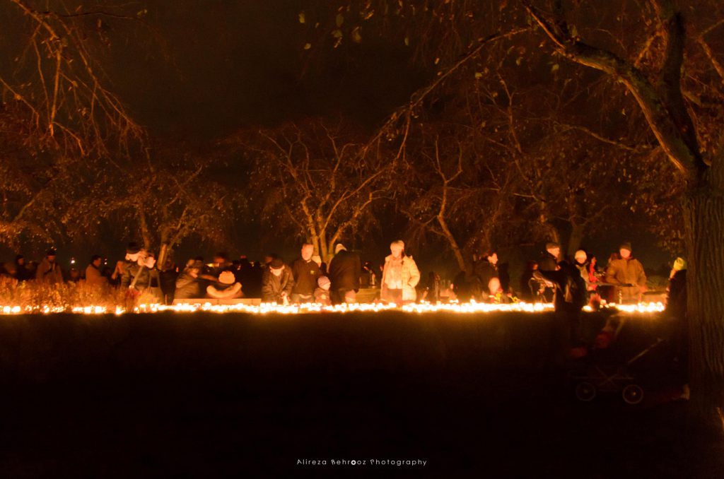 People lighting candles on All Saints’ Day.
Skogskyrkogården cemetry, Stockholm.