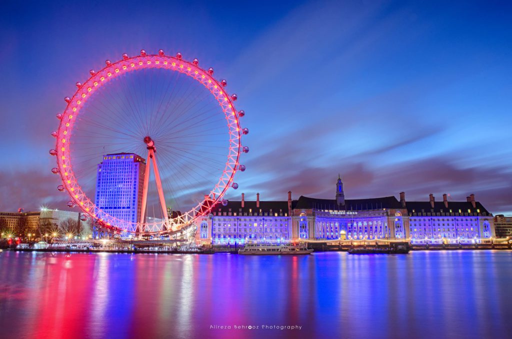 London Eye and town hall at night over River Thames