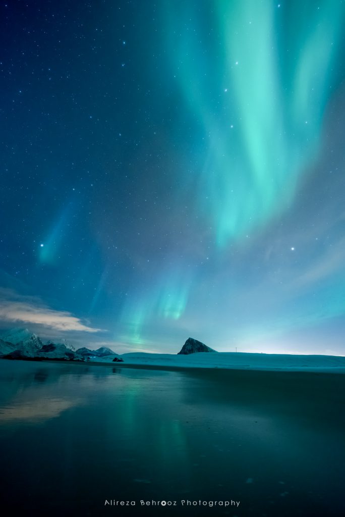 Nortern lights reflected in the sandy Storsandnes beach, Lofoten